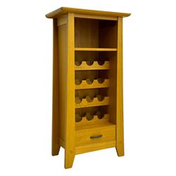 Contemporary light oak wine cabinet, rectangular overhanging top above an open shelf, fitted with four bottle racks each holding three bottles, single drawer with curved metal handle, on chamfered supports