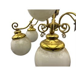 Two tier brass plated nine branch light fitting, with decorative scroll work 