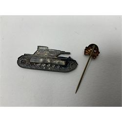 Collection of eleven German metal and cloth badges and uniform buttons including driver's badge, two 'SS' fabric skulls, private's shoulder tabs, Police cloth badge, tank destruction badge, medal bars and ribbon etc; most WW2 period