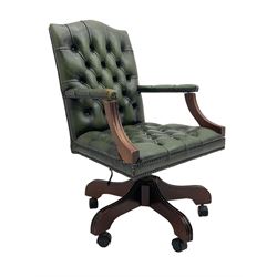 Georgian design swivel office desk chair, upholstered in buttoned green leather, on five spoke base with castors 