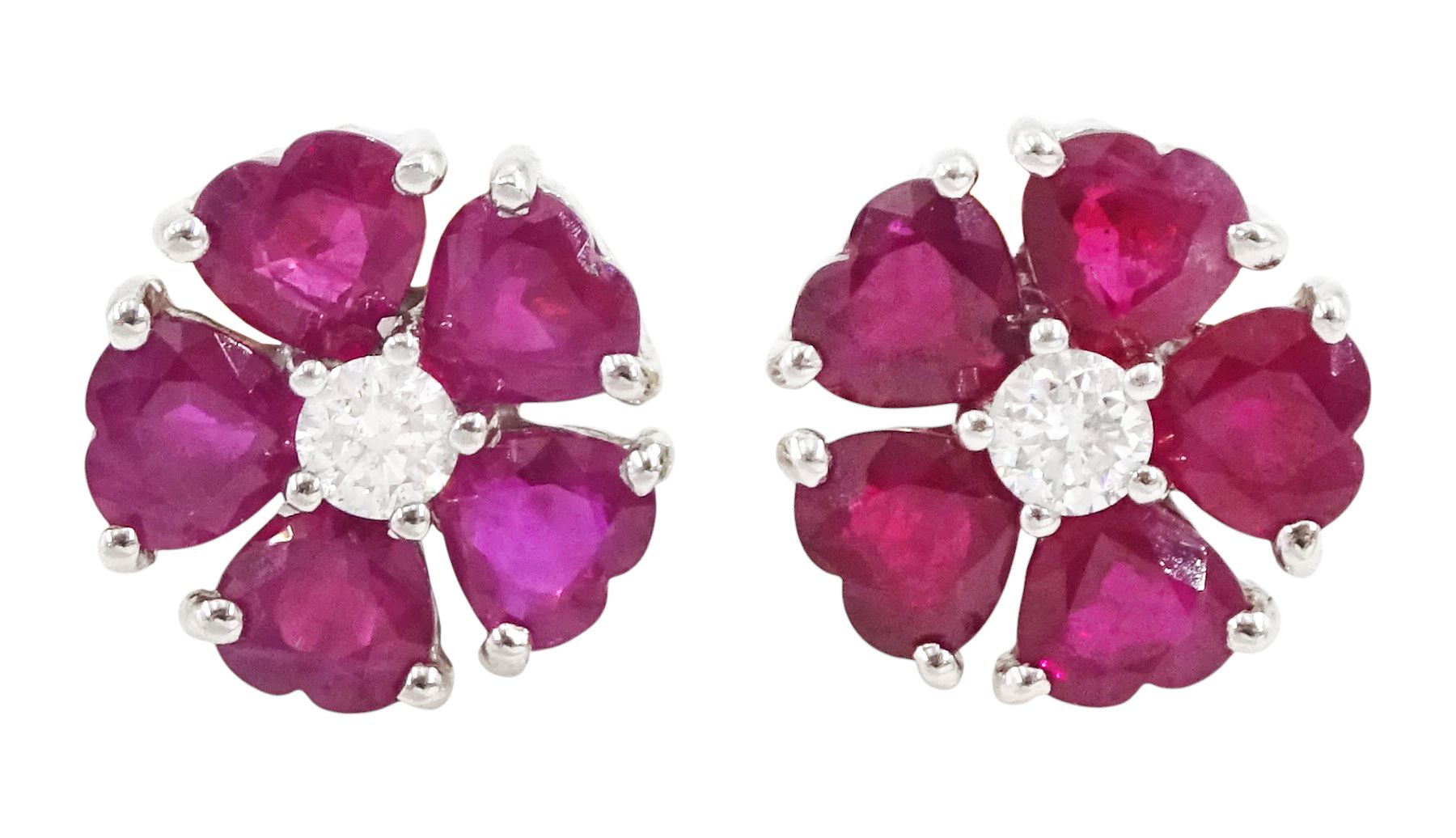 Pair of 18ct white and yellow gold heart cut ruby and round brilliant cut diamond, flower head cluster stud earrings, Sheffield 2001, total ruby weight approx 2.85 carat, total diamond weight approx 0.20 carat