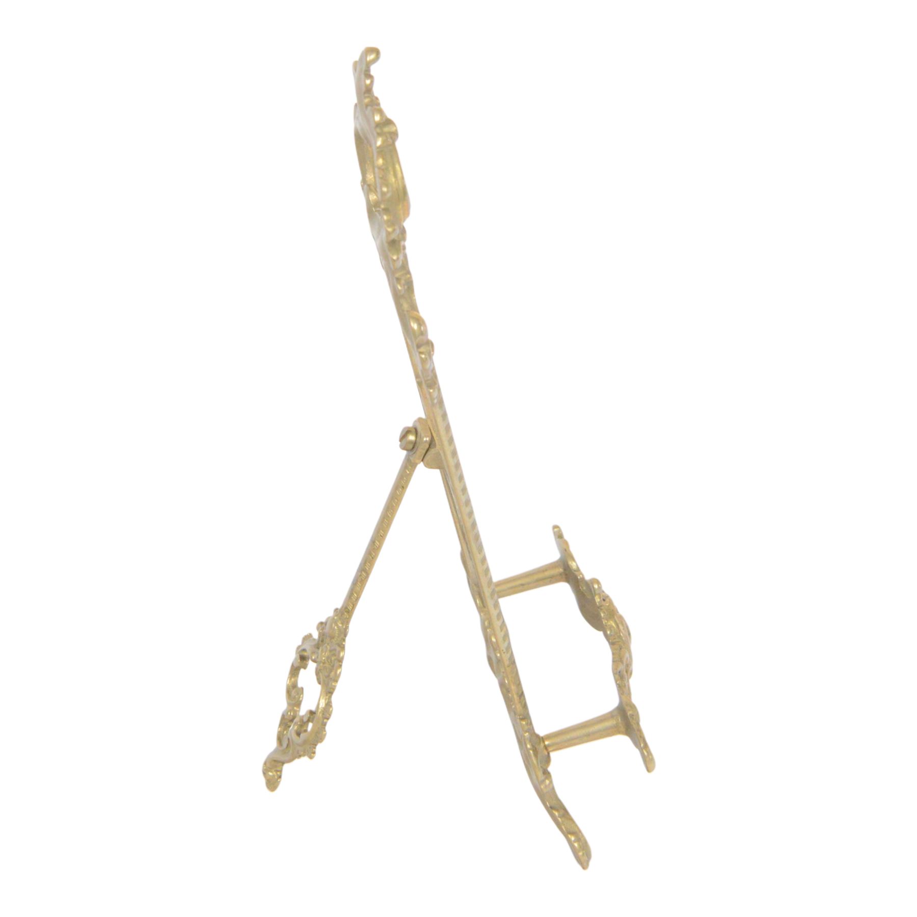 Three Baroque design brass table easels, the largest with cast mask detail, H47cm, and two matched graduated examples, smallest H25cm