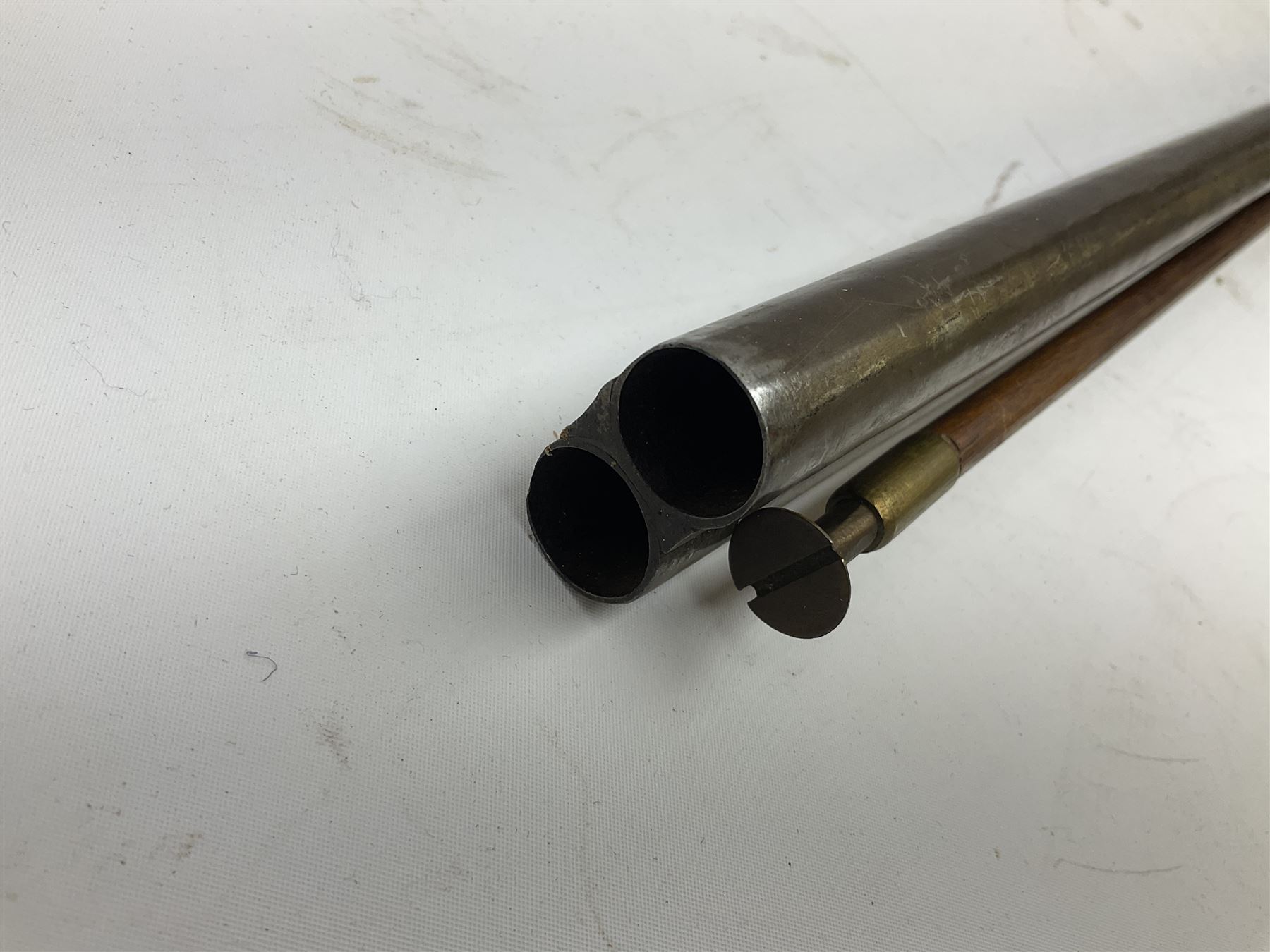 19th century 13-bore double barrel side-by-side percussion cap shotgun, the 72cm stub twist damascus barrels with ramrod under, walnut stock with chequered grip L117.5cm overall