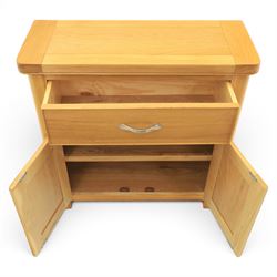 Modern oak living room set comprising; a small side cabinet, corner TV stand and coffee table, cabinet with single drawer and cabinet, finished with metal handles (H 80cm, D 32cm, W 80cm), TV stand with open recess and rear aperture for wires, above nine drawers with chrome pulls (H 62cm, D 50cm, W 84cm)  coffee table with curved edges and full length undertier (H 50cm, D 60cm, W 90cm)  