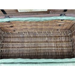 WW2 British Army RAMC 'Regimental Medical Pannier', well marked externally and dated 1941, stamped May 1943 internally, canvas covered wicker form with leather edges, hinged top and fall front with two rope carrying handles, fitted iron locking straps with securing chains; contains various unused field dressings and bandages with WW2 dates and two pillows; original label under lid L79cm