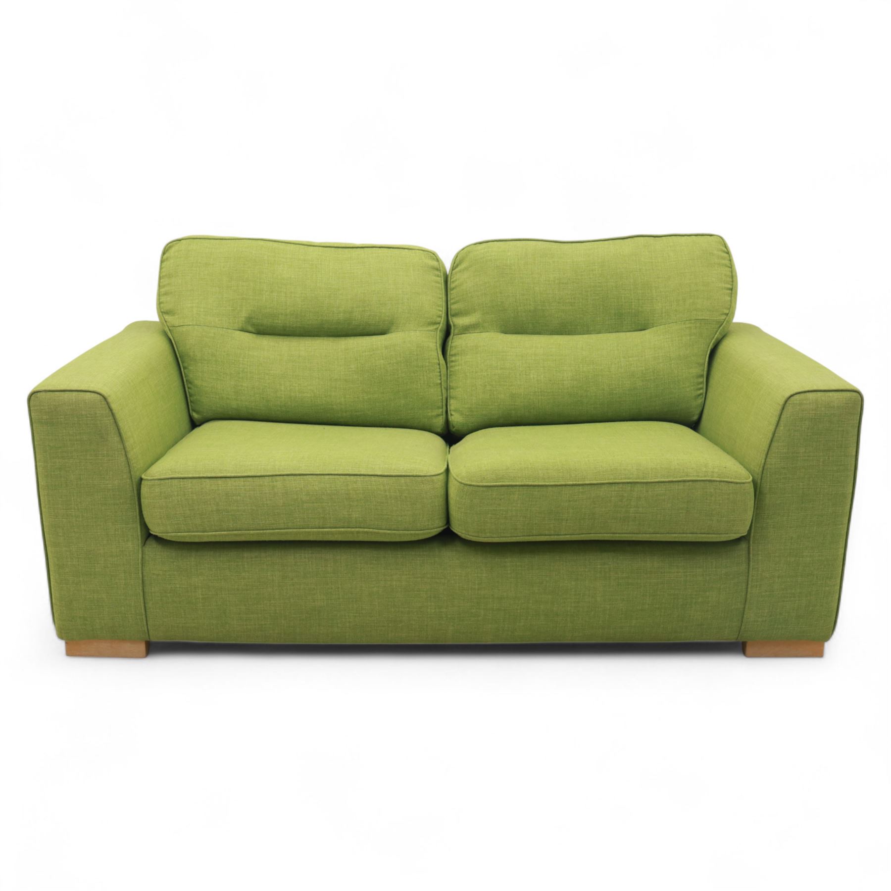 Contemporary lime green upholstered sofa bed, with rectangular arms and two seat cushions, the back with two stitched backrest cushions, on low block feet