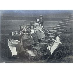 Frank Meadow Sutcliffe (British 1853-1941): Eight Fishergirls at the Foot of Whitby East Pier (E-6C), photograph signed in pencil, initialled and numbered FMS 450 in the image, original  FM Sutcliffe Whitby label verso 14cm x 19cm