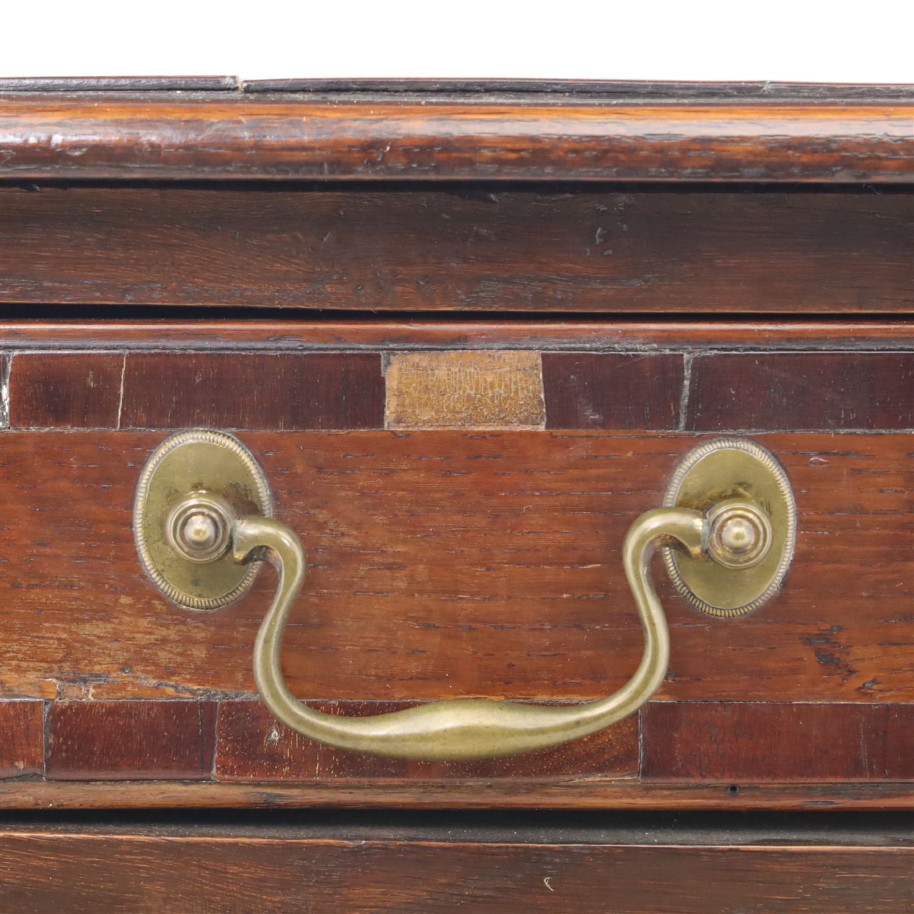 18th century oak and mahogany banded lowboy, rectangular moulded top with crossbanded edge, fitted with one long and two short drawers with brass swan neck handles, shaped kneehole apron, raised on cabriole supports with pad feet