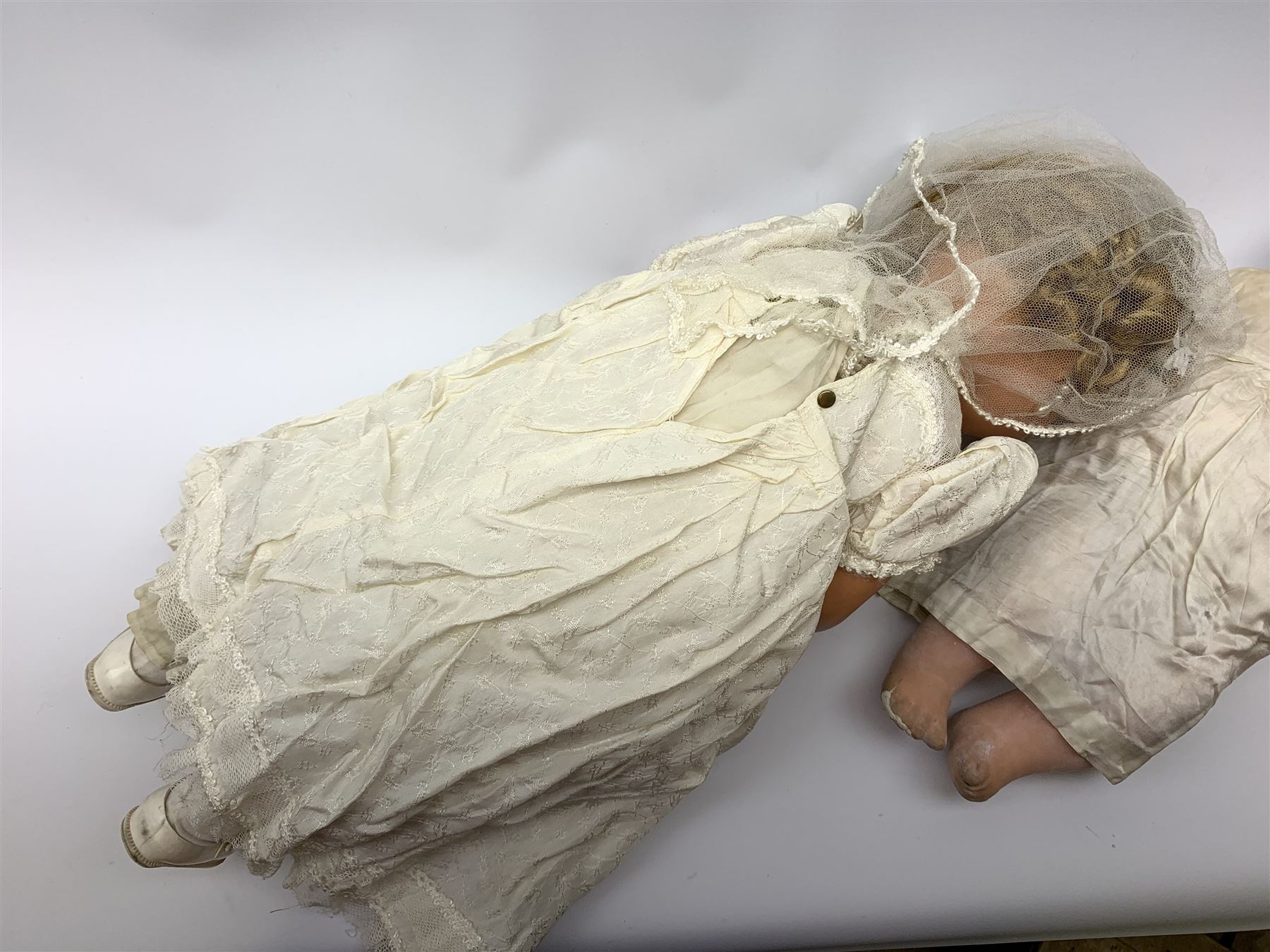 Seyfarth & Reinhardt composition head baby doll with moulded hair, sleeping flirty eyes, open mouth with one tooth and tongue and soft body with composition jointed limbs, marked 'SuR Germany 30/5' H47cm; together with a Golborne Dolls 'Golborne Beauty' composition head and body bride doll, marked 'F.P.23' in original box H63cm (2)