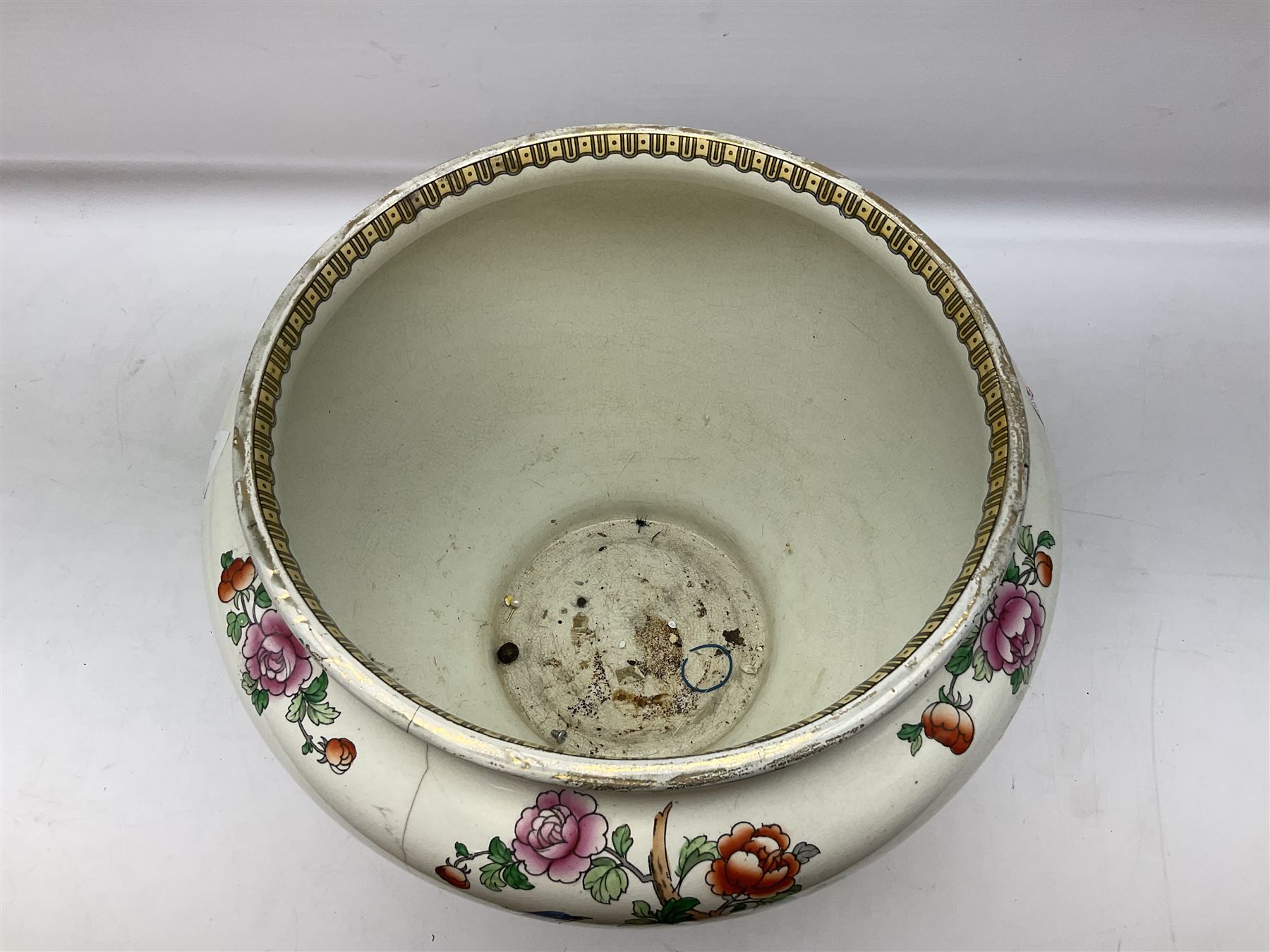 Large ceramic Jardiniere on stand, decorated with an oriental pheasant perched upon branches blossoming with peonies and foliage on white ground, overall H99cm