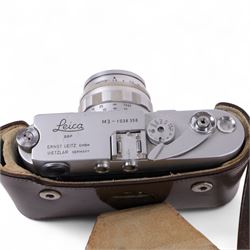 Leica DBP M3 35mm rangefinder camera body, serial no. 1038356, circa 1961, in chrome finish, housed in brown leather Leica case, with a Leitz Wetzlar Sunnilux 1:1.4/50 lens serial no. 1845148, Leitz Wetzlar Elmar 1:4/135 lens serial no. 1825980, 12575N hood, 12521G hood, Leica Meter MC serial no. 99015, Sunpak Auto28 SR Thyristor, Linhof 3 Way Pan tripod, and a Toshiba PE-1 Linear Exposure meter, all housed in an Original Benser Everready Case, most items with instruction booklets 