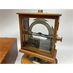 W & J George Ltd Nivoc dip circle in revolving double-glazed case with bevelled panels and adjustable feet H27cm; early 20th century Griffin & George Ltd. Induction Coil Spark Generator on mahogany base; and J. Heal Violet Ray High Frequency Generator; in wooden case with range of glass attachments (3)