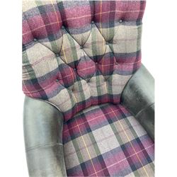 John Sankey - low armchair, buttoned back upholstered in tartan patterned fabric with contrasting grey leather, raised on turned and ebonised front feet with brass and ceramic castors, with matching foot stool