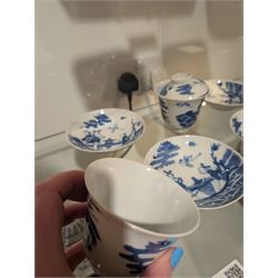 Pair of Chinese blue and white tea bowls, one with cover and four saucers, depicting two figures on a boat at sea, tea bowl H7cm