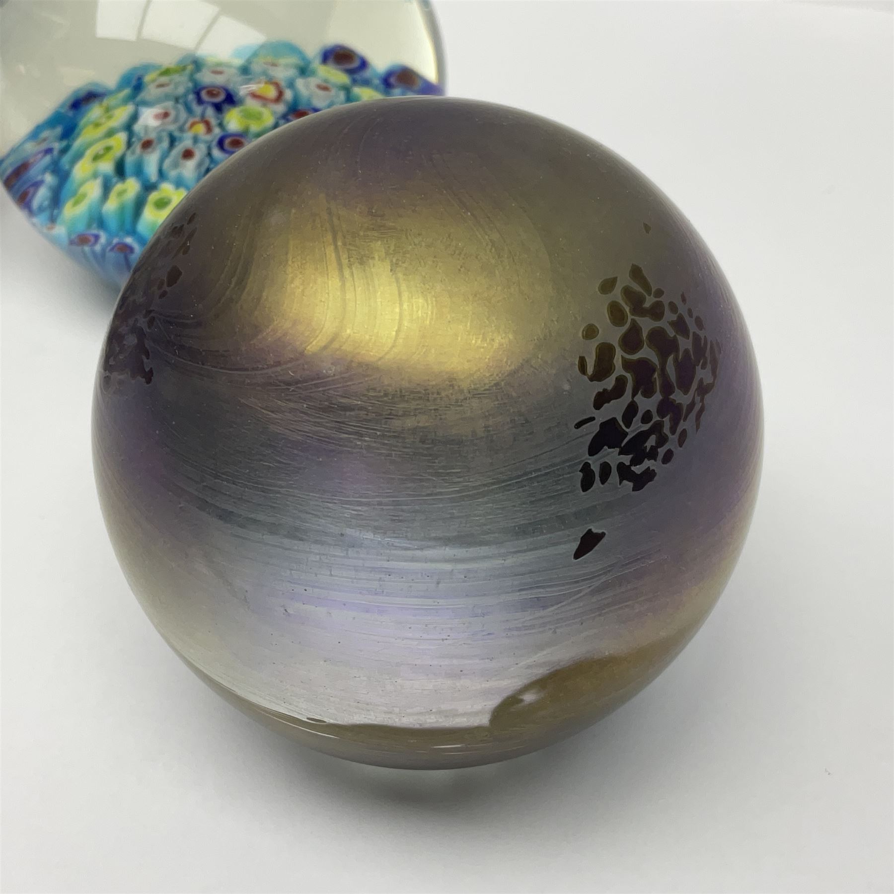 John Ditchfield for Glassform iridescent glass paperweight, together with two millefiori paperweights and one other 