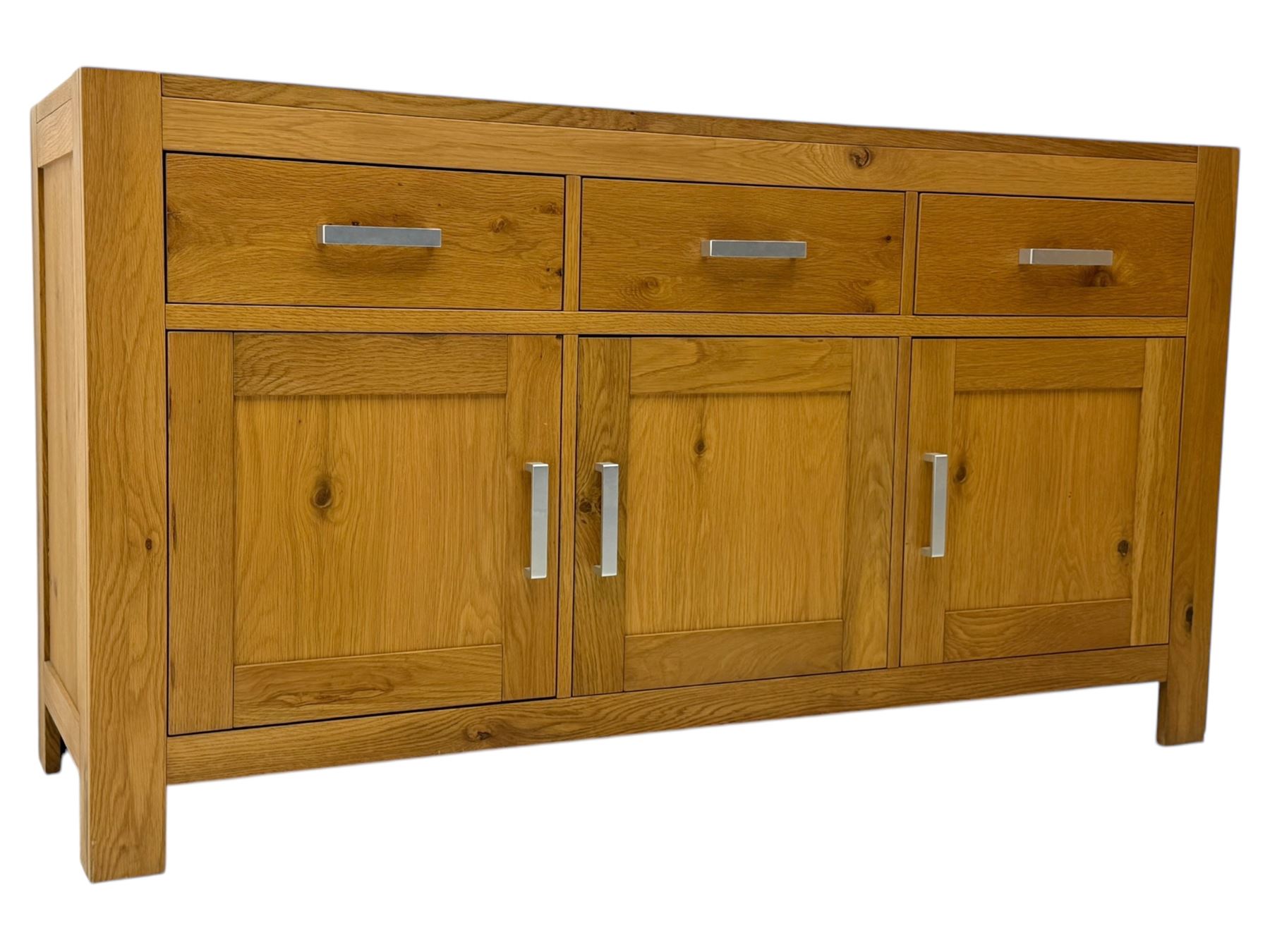 Light oak sideboard, fitted with three drawers and three cupboards, metal handles