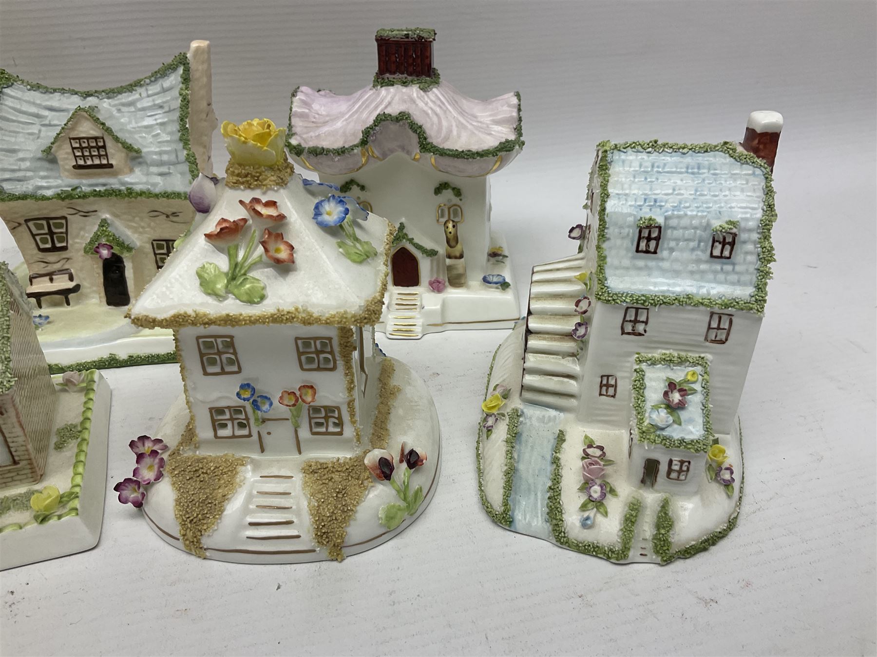 Eleven Coalport cottages, including Park Folly, The Alms House, Watermill and The Summer House, each with printed marks beneath