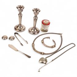 Pair of weighted silver candlesticks, silver tongs, silver knife, silver threepence coins, silver and costume jewellery