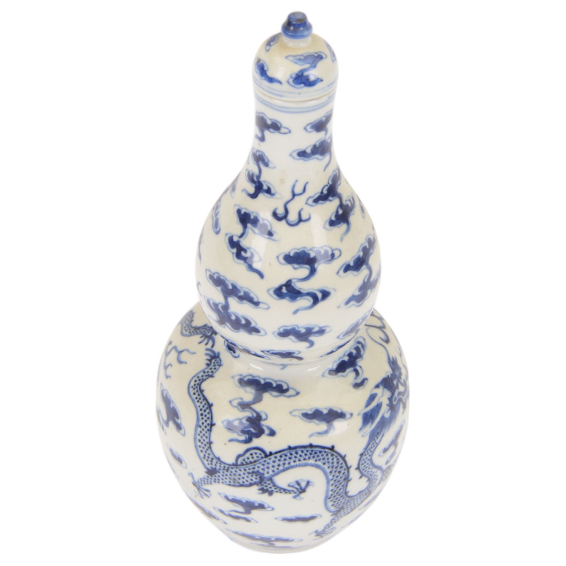 Chinese Kangxi style double-gourd form vase, the blue and white vase surmounted by a domed cover, decorated with dragons chasing a flaming pearl, four-character mark to beneath, H31cm