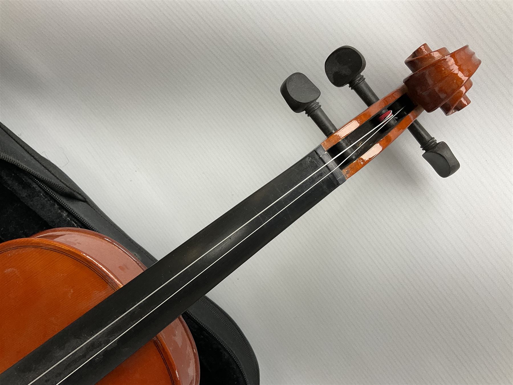 Dean small or child's size electric guitar in black, serial no.O09121956 L85cm; in gig bag; and modern student's violin with 35.5cm two-piece back in fitted carrying case with older bow (2)