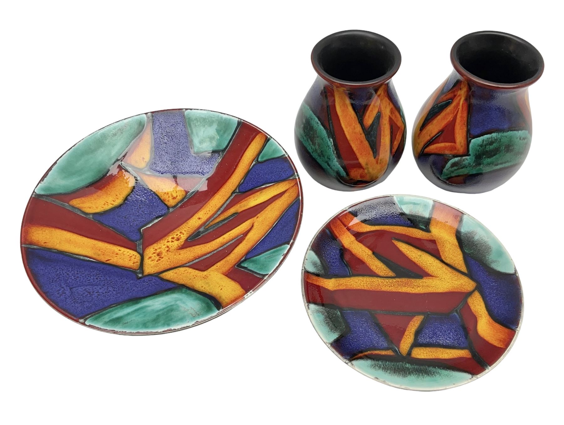 Four pieces of Poole Pottery in Graffiti pattern, comprising pair of vases of baluster form, dish and small plate, with impressed or printed marks beneath, vase H17cm