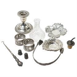 Two Indian white metal napkin rings, sterling silver candlestick, pair of silver heart sha...