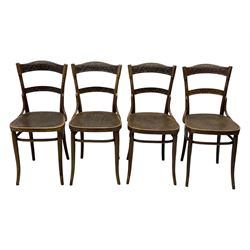 Jacob & Josef Kohn - set of four early 20th century Austrian bentwood chairs, each with carved decoration to the shaped backrest and shaped seat, on splayed supports with stretchers, marked with the manufacturer's stamp and paper label beneath