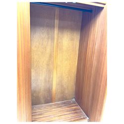 William Lawrence - mid-20th century teak double wardrobe, upper storage section over twin doors featuring recessed handles and contrasting horizontal panel, enclosing a hanging rail compartment, on plinth base with concealed castors