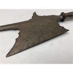 Moroccan jambiya dagger with 24.5cm plain curved blade stamped LONDON to the ricasso area, the hilt and scabbard overlaid with plain sheet brass to the back and ornate silver coloured metal to the front; waisted grip and arched pommel; two pyramid mounts to the scabbard L41cm overall; large billhook with curving blade and stacked leather washer grip; and a reproduction halberd blade (3)