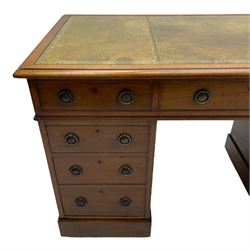 Howard & Sons. - 19th century walnut twin pedestal desk, moulded rectangular top with tooled leather inset, fitted with nine drawers with circular pressed brass handle plates decorated with urns, each drawer fitted with a 'Hobbs, London' lock, on plinth base, the upper right-hand drawer stamped 'Howard & Sons, Berners St.' and with paper label