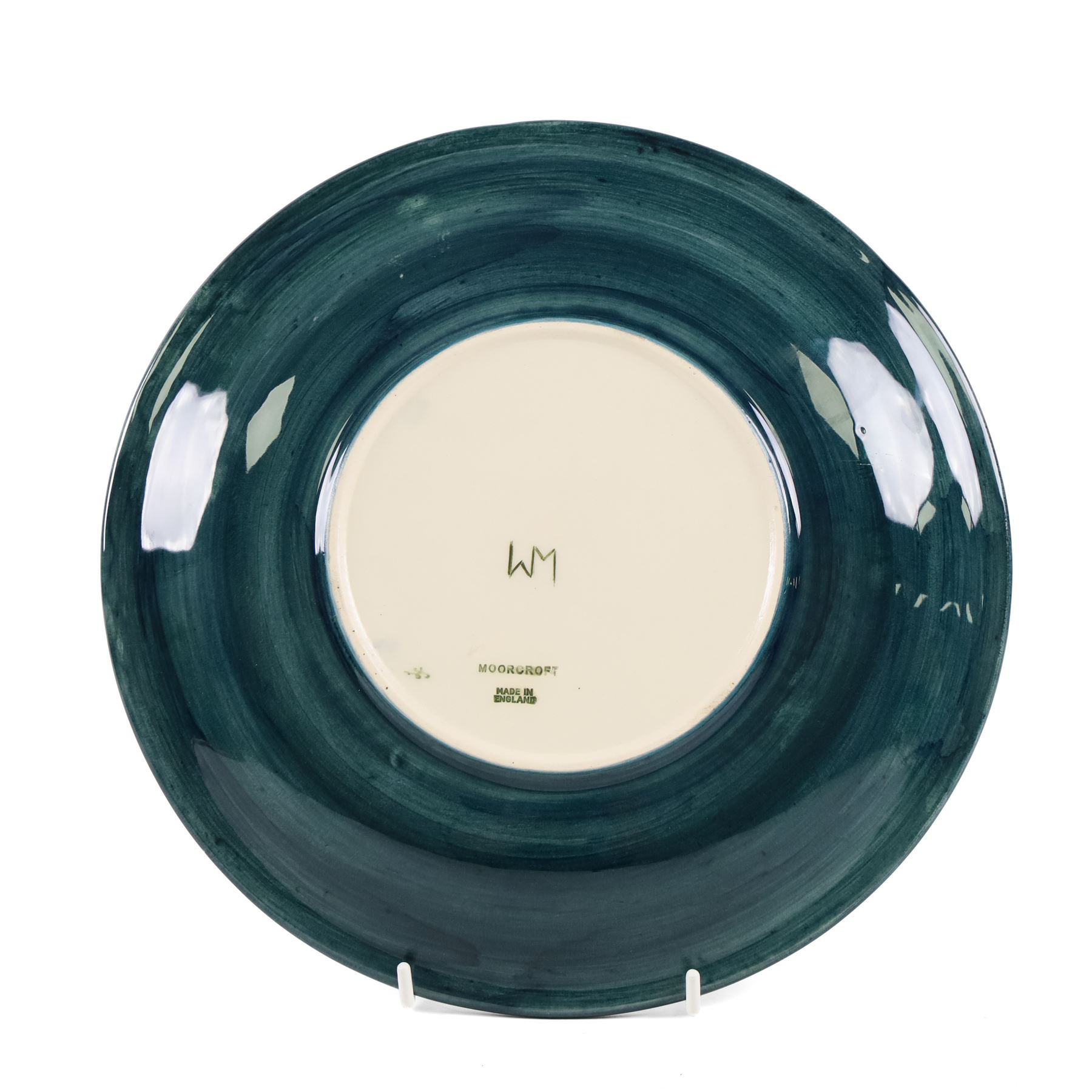 Moorcroft Fairy Ring plate, 1990, decorated with mushrooms upon a green ground, with painted and impressed marks beneath, D26cm