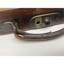 Leather shotgun case, the red baize lined interior with the trade labels of Westley Richards & Co., London, a brass plaque inscribed 'T Nevin, Mirfield, Yorkshire' to cover, with key, case to fit barrel 76cm (30 inches)  
