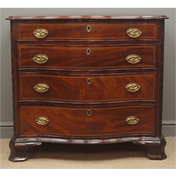  Early 19th century mahogany serpentine front chest, moulded top above four long graduated cockbeaded drawers outlined with chequer banding and with oval brass handles, enclosed by blind fret carved canted angles, on ogee bracket feet, W100cm, H93cm, D53cm  