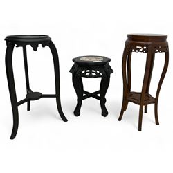 Group of three oriental hardwood and ebonised plant stands, including a round two-tier tab...