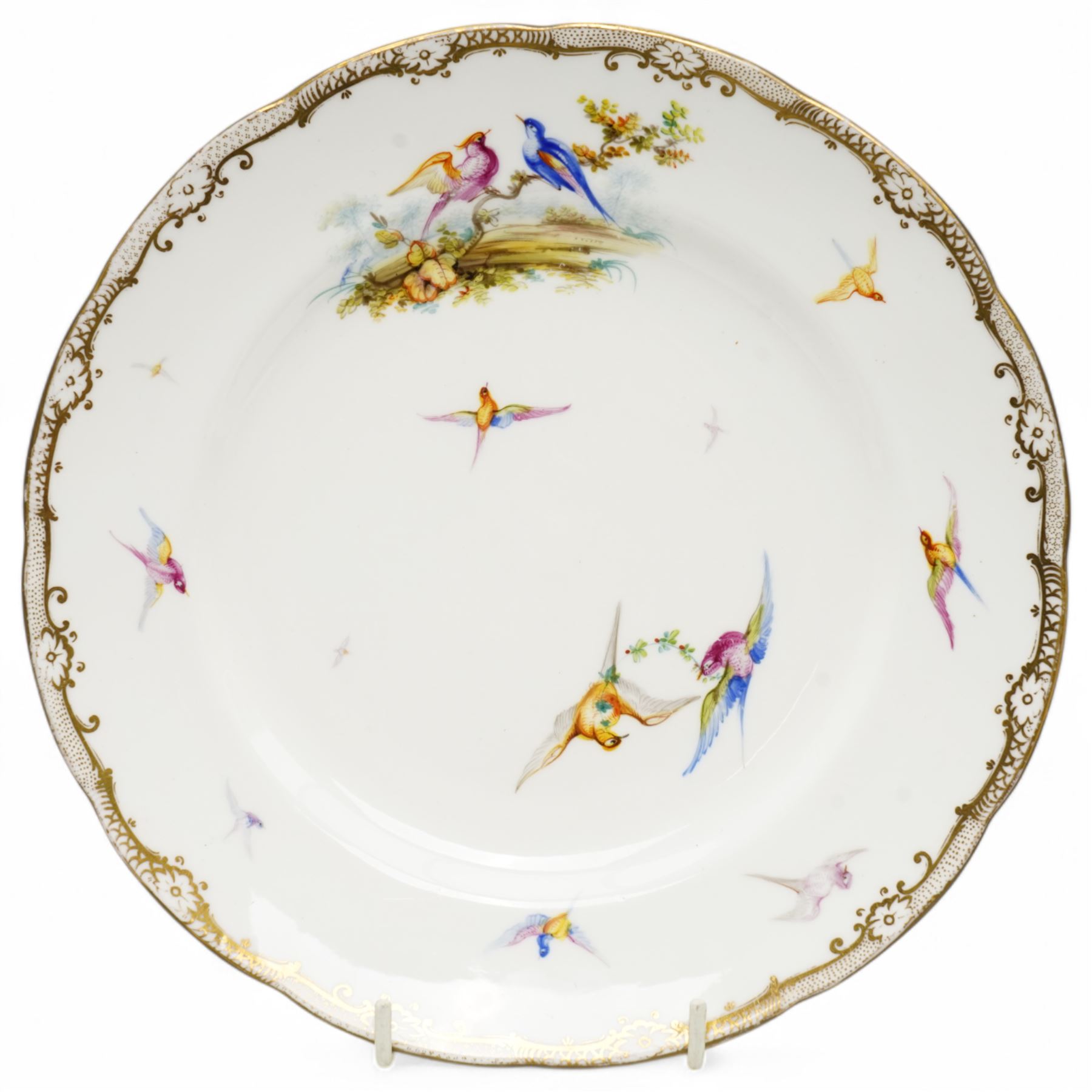 Pair of Coalport cabinet plates, c1850, painted by John Randall with various exotic birds in flight within gilt trailing foliate boarders, D23cm 