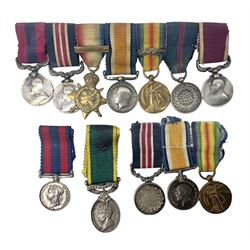 George V Military Medal and Distinguished Conduct Medal miniature group of seven medals comprising MM, DCM, WW1 trio including 1914 Star with date clasp and MID leaves, The Great Durbar Delhi 1911 Medal and LSGC; on pinned wearing bar; WW1 Military Medal miniature group of three comprising MM, BWM and Victory; Victoria North West Canada 1885 miniature; and George VI miniature Territorial Efficiency medal; all with ribbons