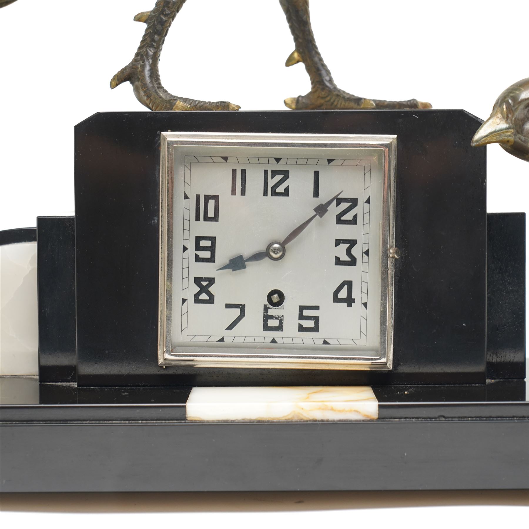 French- Early 20th century Art Deco mantel clock with an 8-day timepiece movement, on a polished rectangular slate base, with inset cream onyx panels, surmounted by a pair of highly decorative bronze effect pheasants, square 4