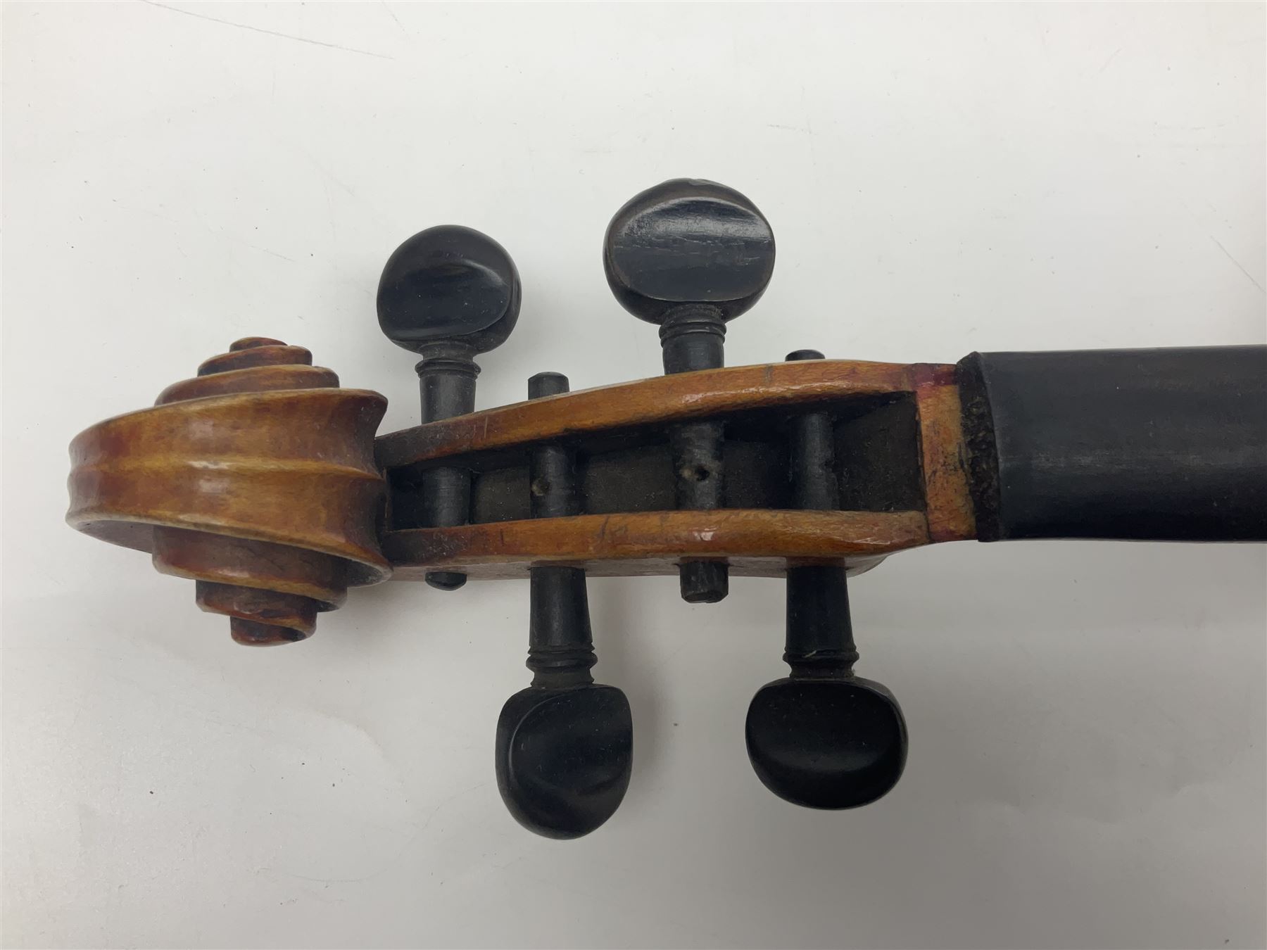 German trade violin c1900 copy of a Maggini with 36.5cm two-piece maple back and ribs and spruce top; double scroll; L60cm overall; in carrying case