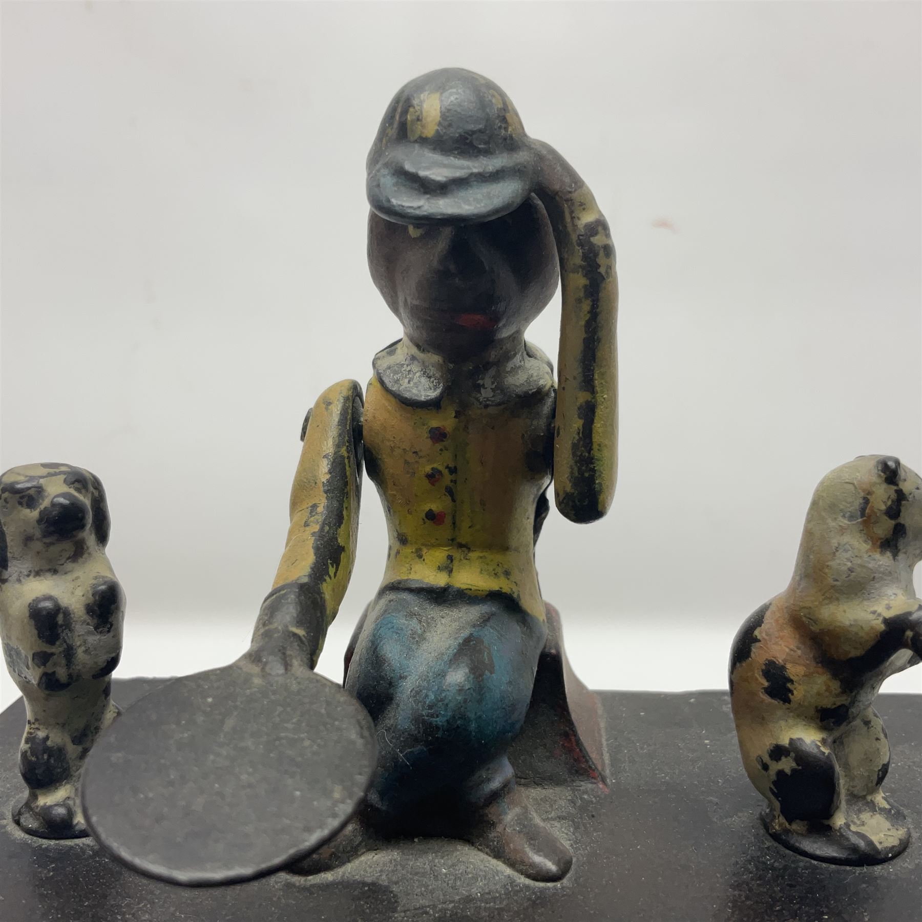 American 'Organ Bank' musical cast-iron mechanical money bank with hand cranked action and seated figure with two dancing dogs on top; locking door to base (no key); marked to the back 'Pat June 13 1882', H19cm