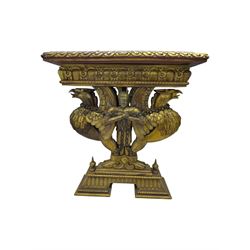 19th century Renaissance Revival carved and giltwood centre table, the rectangular top with gadrooned edge and carved frieze of repeating arched motifs with stylised scrolls, supported by a pair of carved winged griffin supports restrained by a central chained figure, on stepped rectangular bases united by carved stretcher