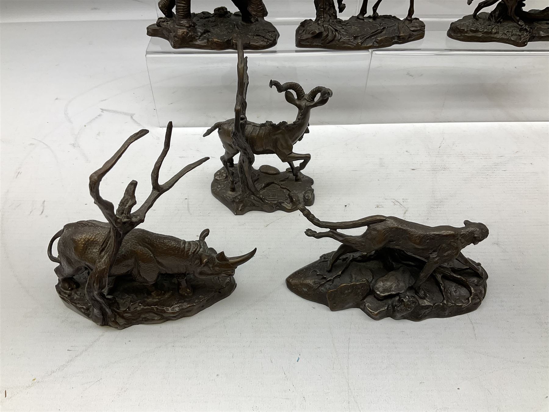 Six Franklin Mint bronze models of African animals, comprising Lion, Black Rhinoceros, Greater Kudu, Cheetah, Giraffe and African Elephant, tallest example H14cm