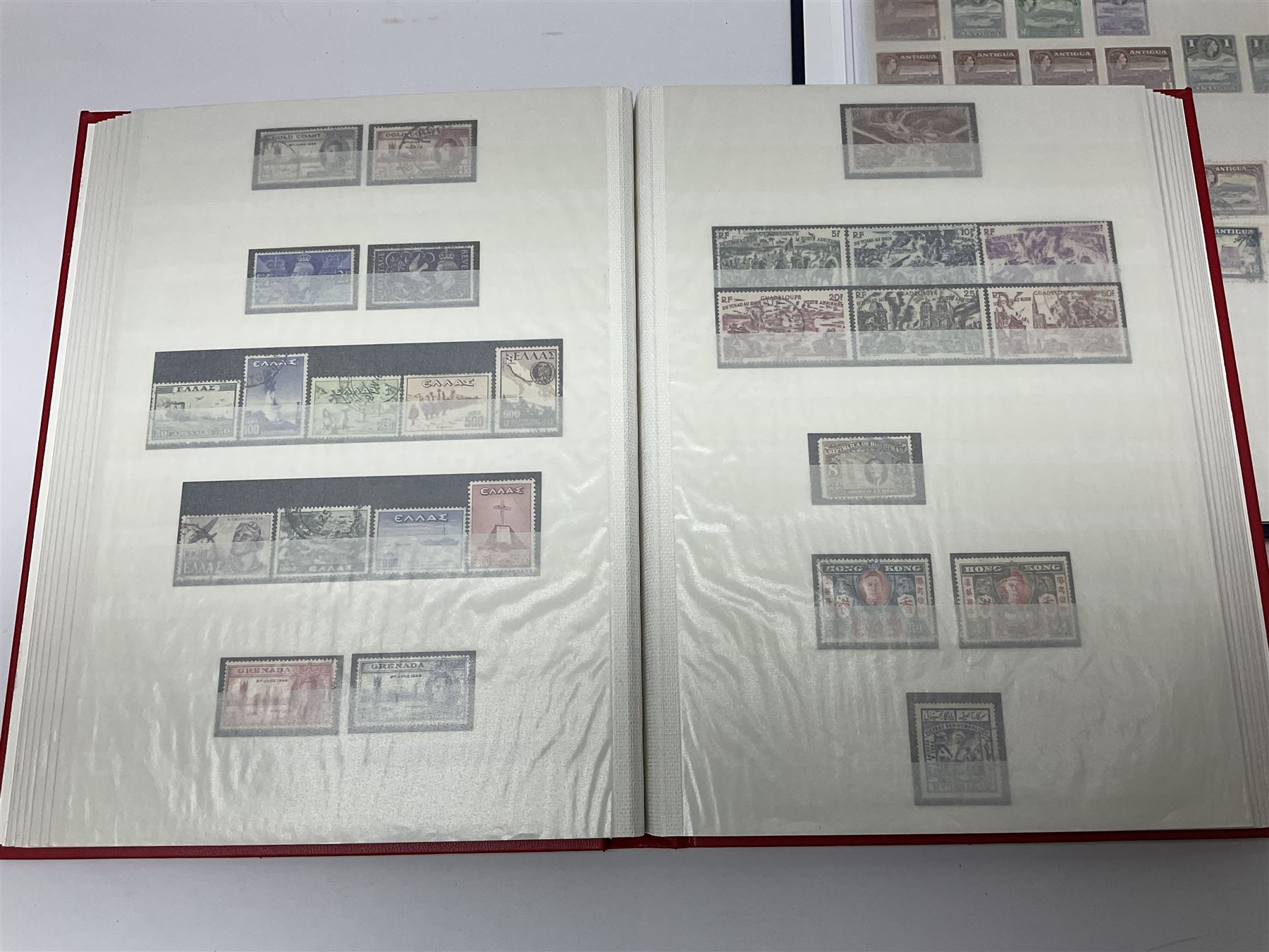 World stamps with many relating to Victory in Europe including King George VI '8th June 1946' stamps from various countries including Antigua, British Guiana, British Honduras, British Solomon Islands, Cayman Islands, Ceylon, Fiji, Grenada, Montserrat, St Helena etc, both mint and used stamps seen, housed in three stockbooks