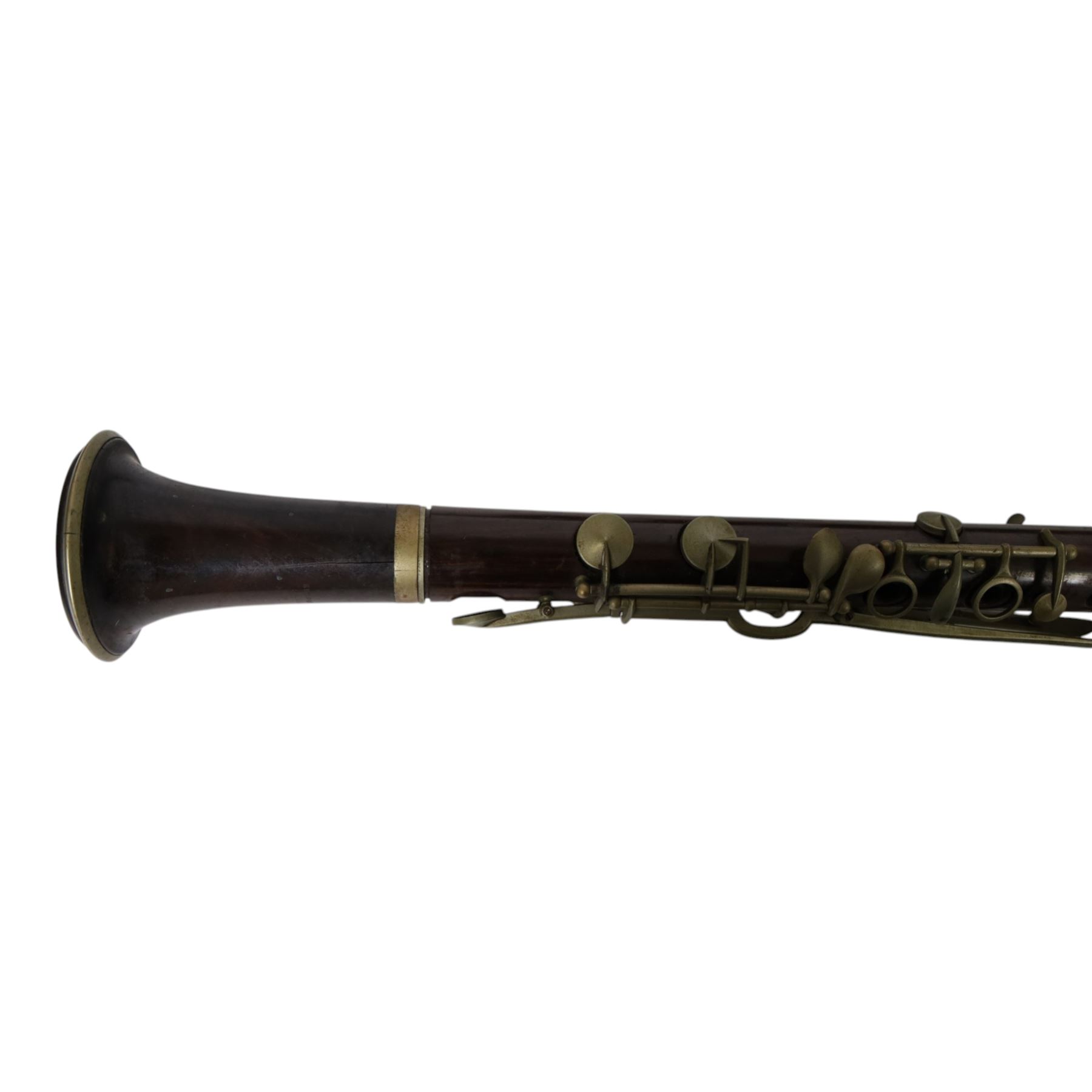 Early 20th century rosewood clarinet by Geo. Potter & Co Aldershot, together with a flute in fitted case, the lid with label reading Edward Potter