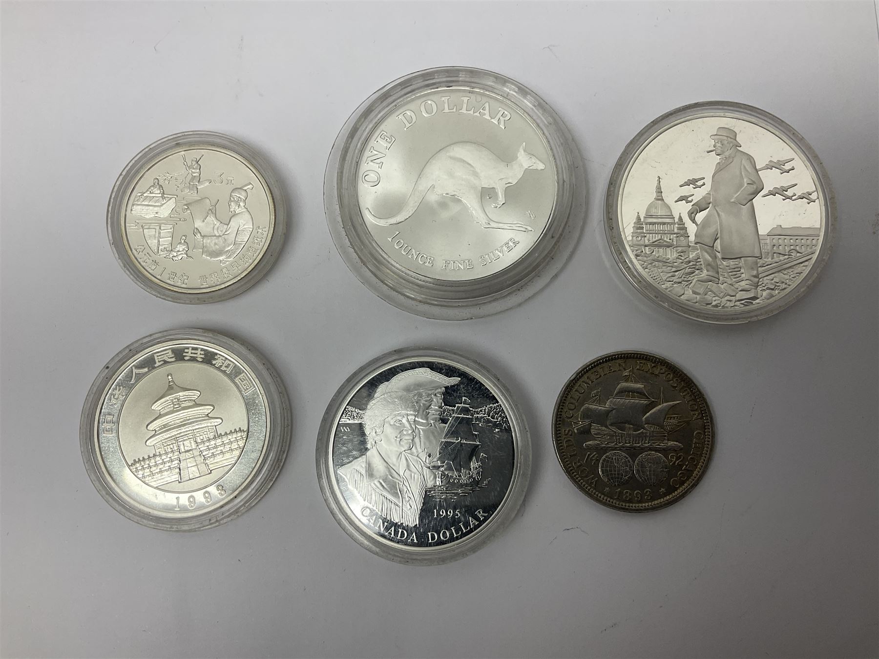 United States of America 1896 Morgan one dollar coin, 1893 'Columbian Exposition' commemorative half dollar, 1945 standing Liberty half dollar, Queen Elizabeth II Australia 1993 one ounce fine silver dollar, Canada 1967 and 1995 one dollar coins etc (15)