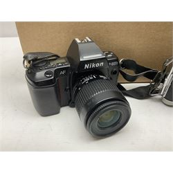Collection of cameras and camera equipment, including NikonF-801s camera body, Cornet Rapide camera body, etc