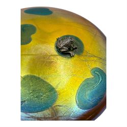 John Ditchfield for Glasform disc paperweight in iridescent yellow with green lily trail and silver hallmarked frog to top, D13cm