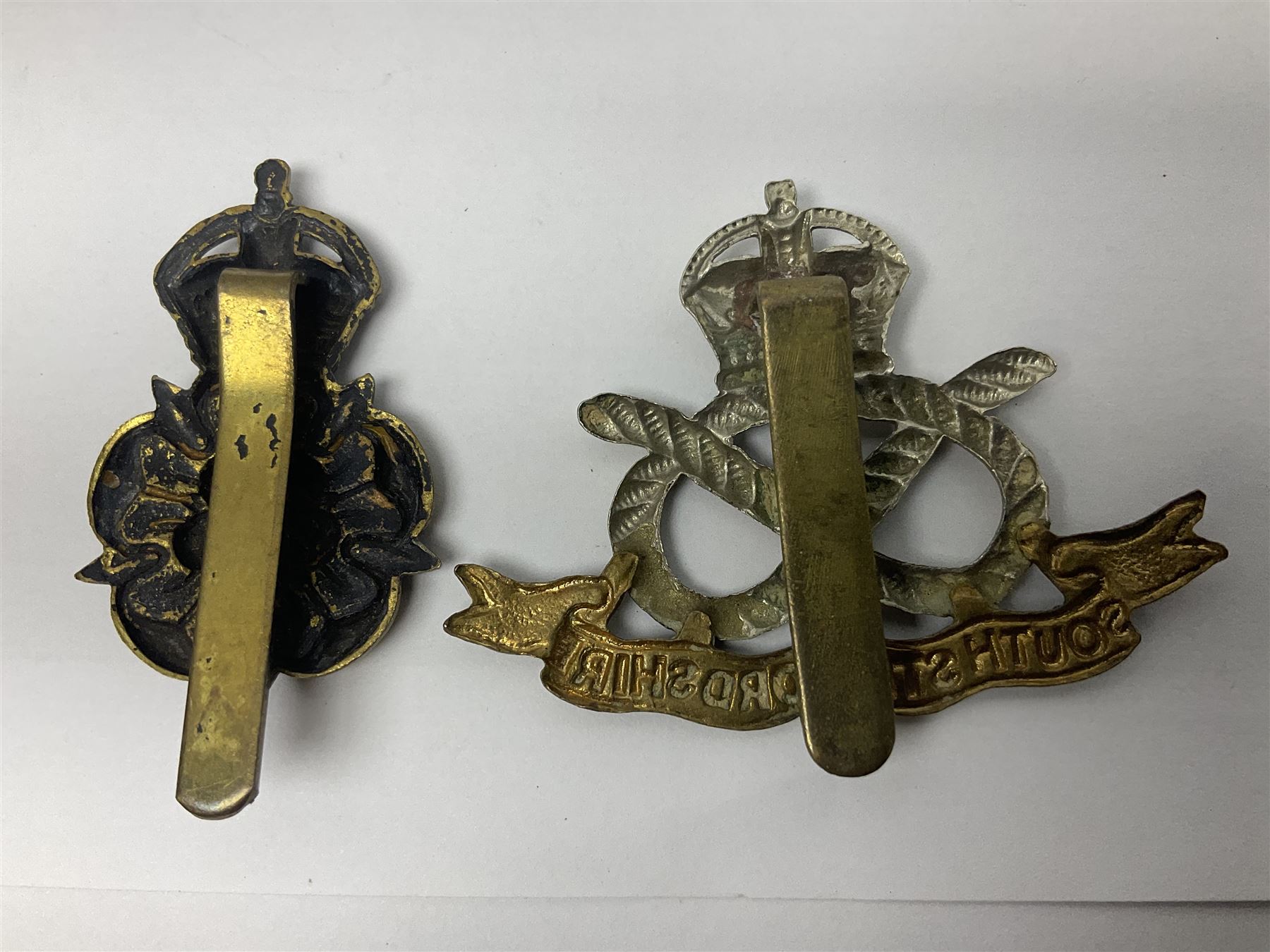 Nineteen Yeomanry metal cap badges including Derbyshire, Northamptonshire, Essex, Glamorgan, Staffordshire, City of London, Surrey, Shropshire, Hertfordshire etc; together with eleven Fusiliers badges including Lancashire, Royal Welch, Northumberland etc (30)