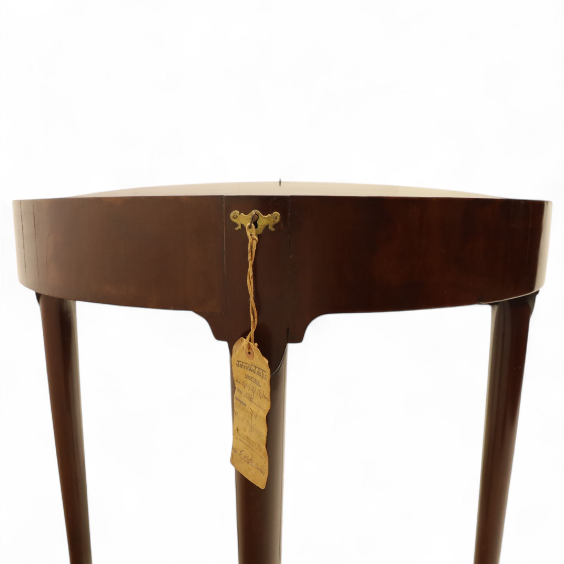 20th-century Georgian Revival style double fold-over card table, the first hinged circular top with polished mahogany surface above a second hinged circular top revealing a green baize playing surface with four counter-wells, underneath with a recessed compartment with and  chip and dice wells, the apron with fitted lock and key, raised on slender straight legs with pad feet 