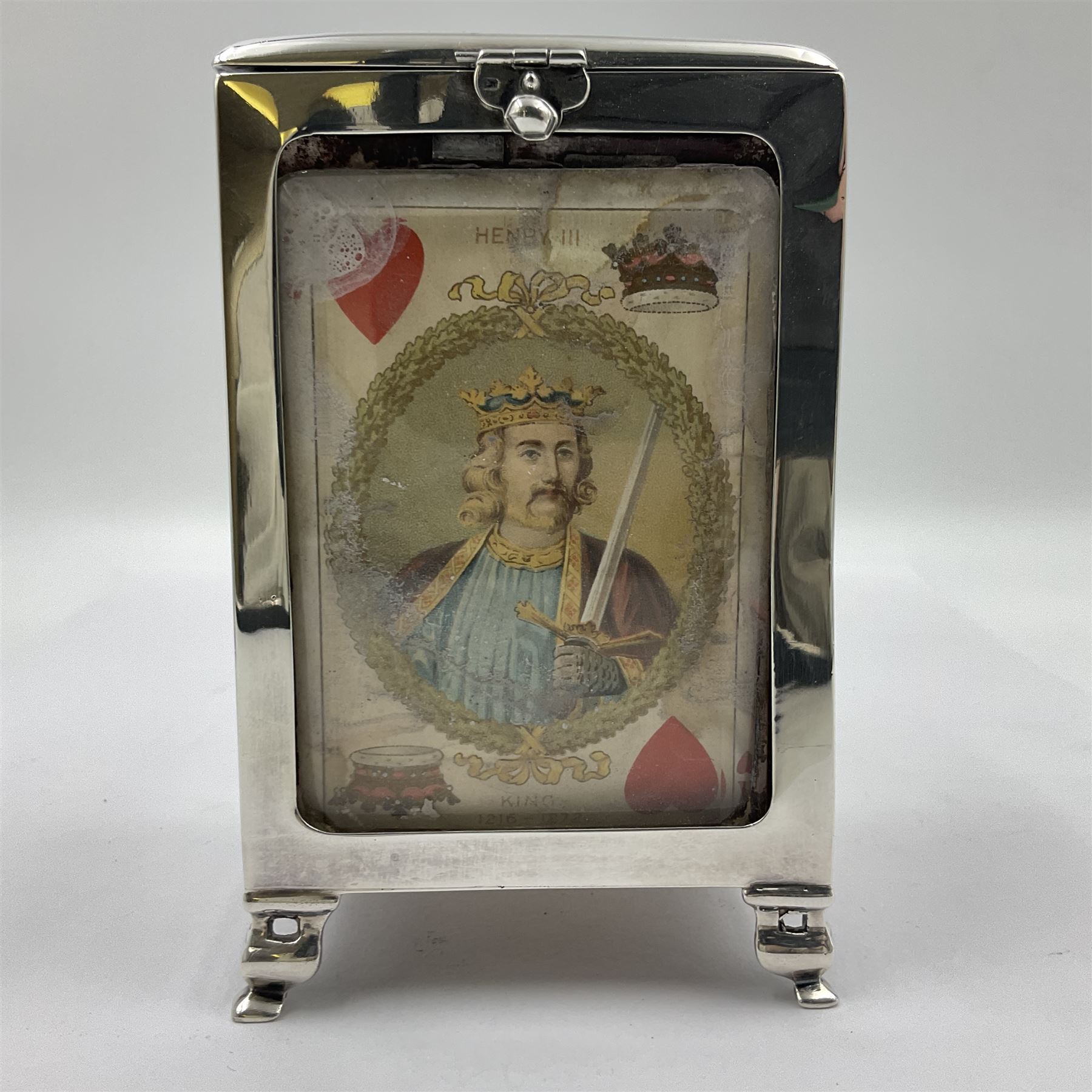 Edwardian silver mounted playing card case, hallmarked William Harrison Walter, Birmingham 1903, the sides each with a period playing card set behind a bevelled glass panel, the hinged cover with later engraving 'Presented to Norman T Crombie Esq by the officers & men of the 31st WR Detachment for services rendered 1917-1918', with red leather lined interior, the three compartments upon a sprung base and containing two later wooden Whist markers, case H12.5cm