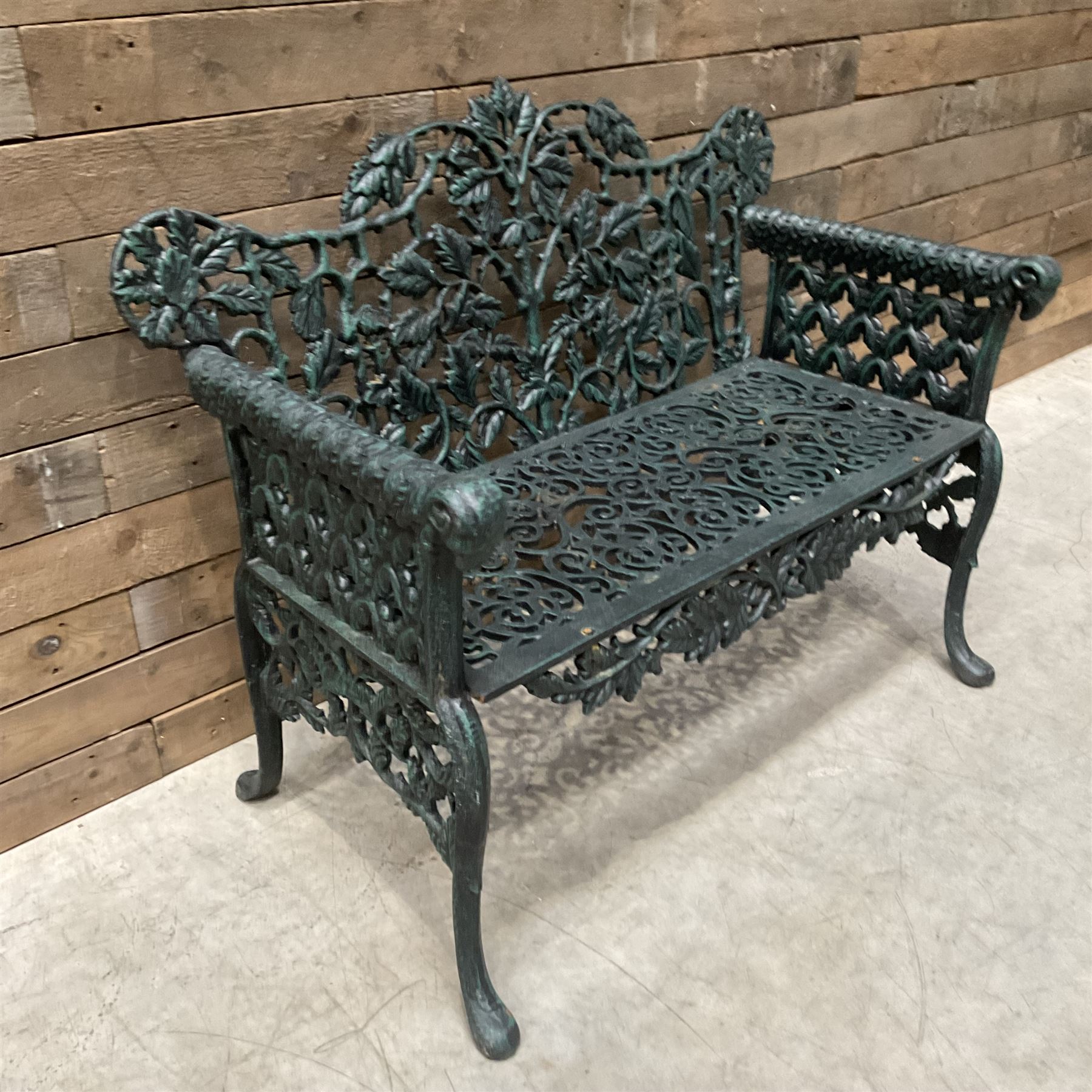 Victorian design heavy cast iron garden bench, ornate shaped back with rope twist and ramshead arms H88cm, W100cm